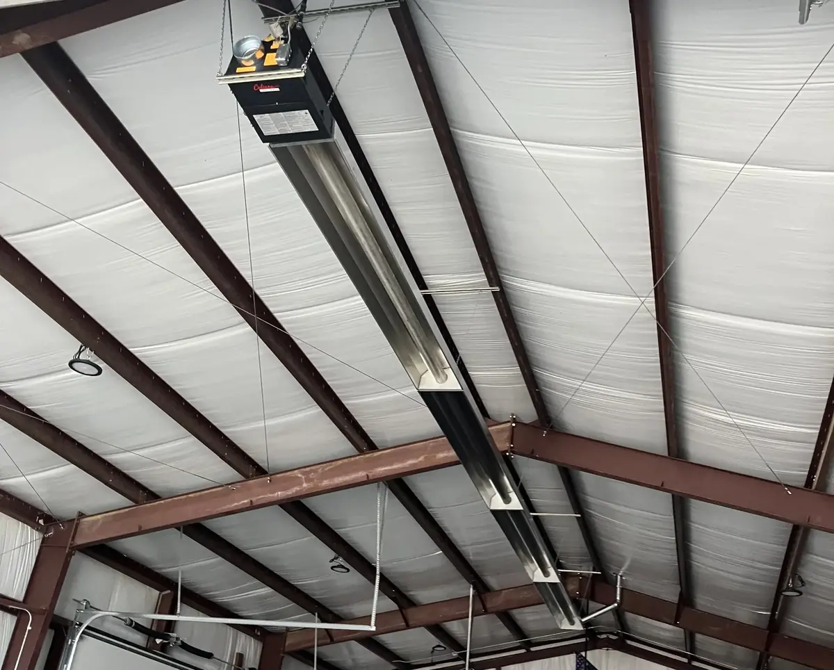 Garage Radiant Tube Heating Installation - Ceiling Mount System Radiant tube heater mounted to garage ceiling structure showing professional installation and optimal heat distribution for large spaces