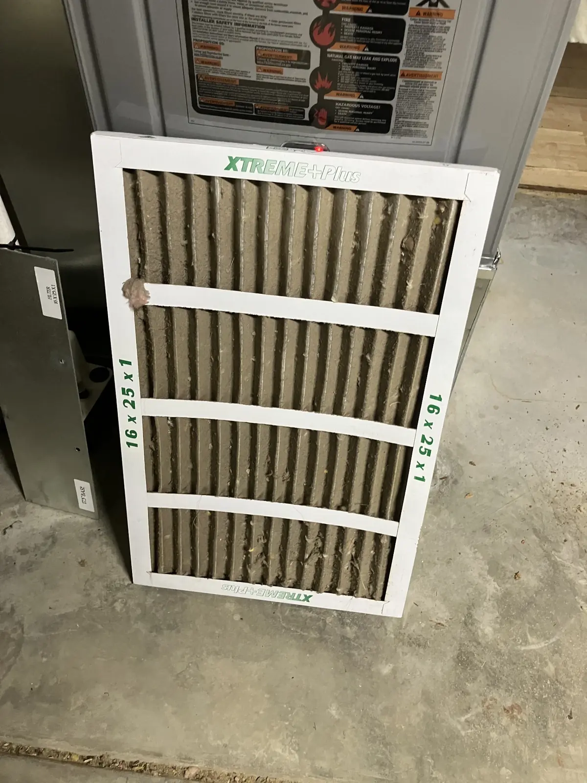 Dirty air filter showing accumulated dust and debris