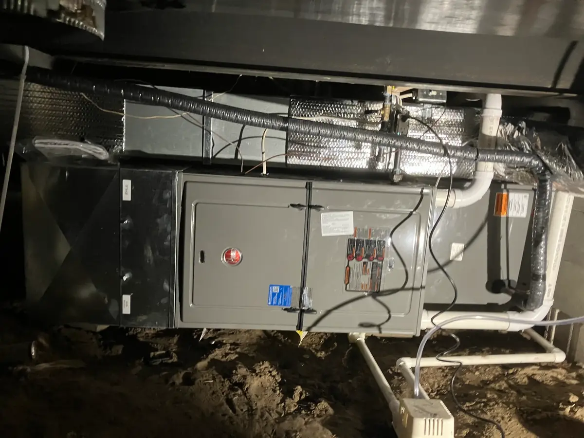 High-Efficiency Furnace Installation - Qualifying System for Rebates High-efficiency residential furnace installation showing professional setup and qualifying equipment for federal tax credits and utility rebates