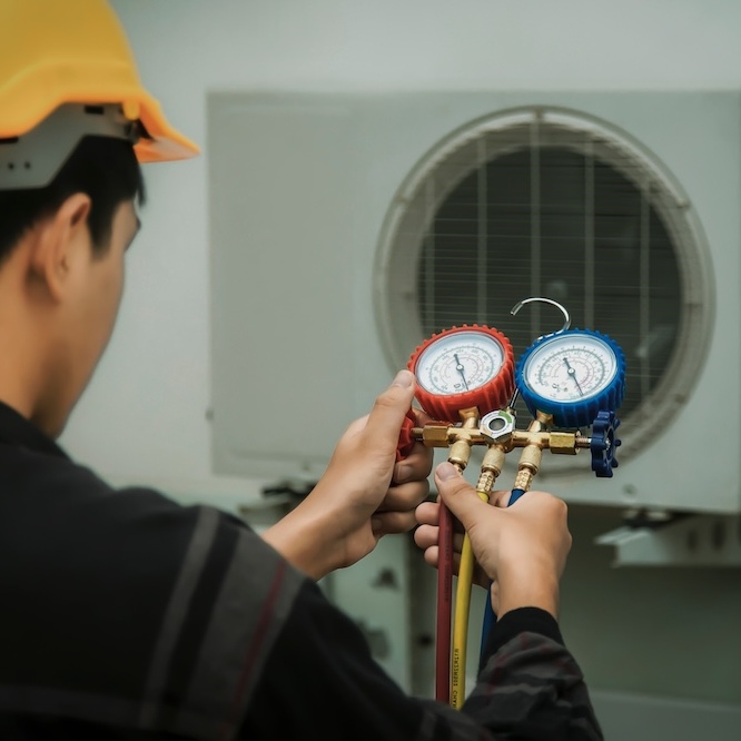 A technician is using a pressure gauge to determine the effectiveness of the machine.