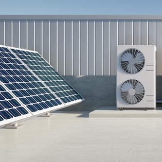 Commercial rooftop with air conditioner compressor and solar panels.